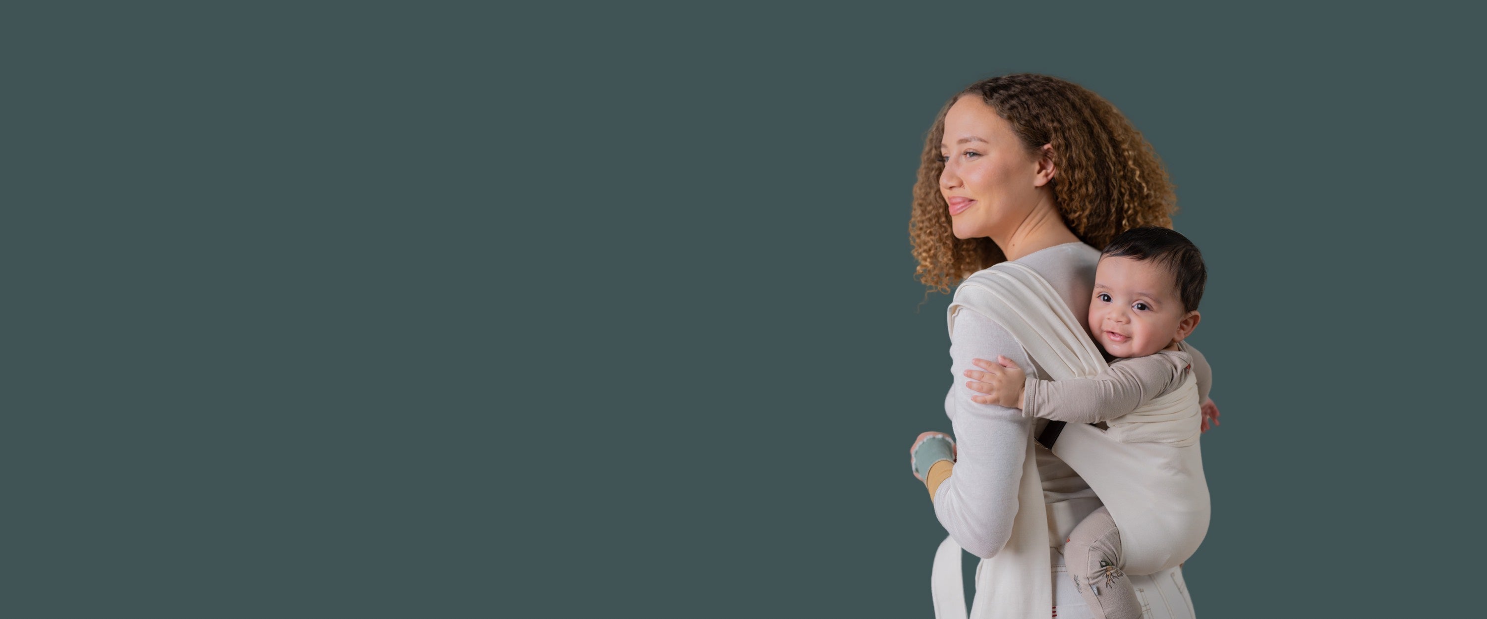 Mom back carrying baby in a Natural Simple Wrap.