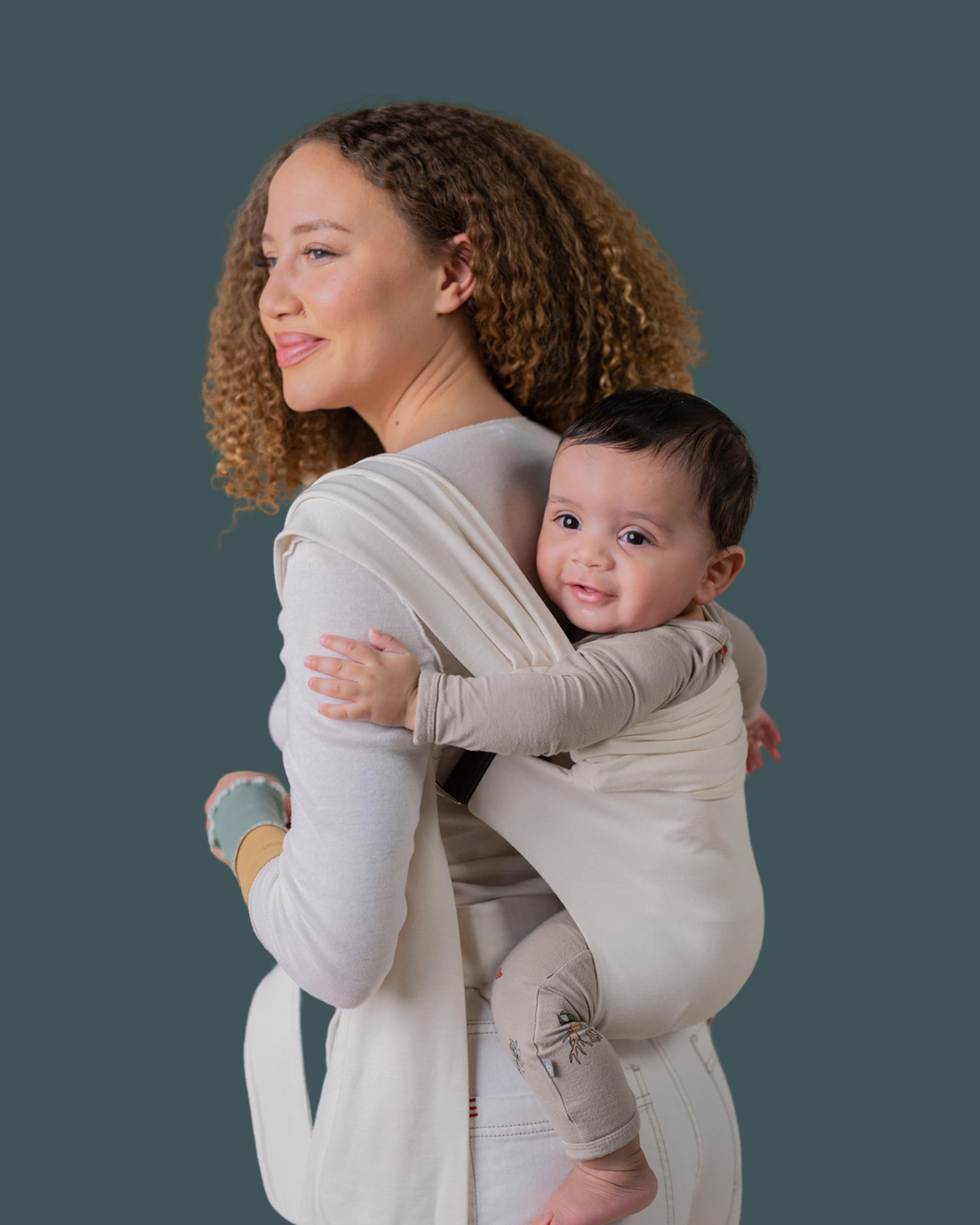 Mom back carrying baby in a Natural Simple Wrap.