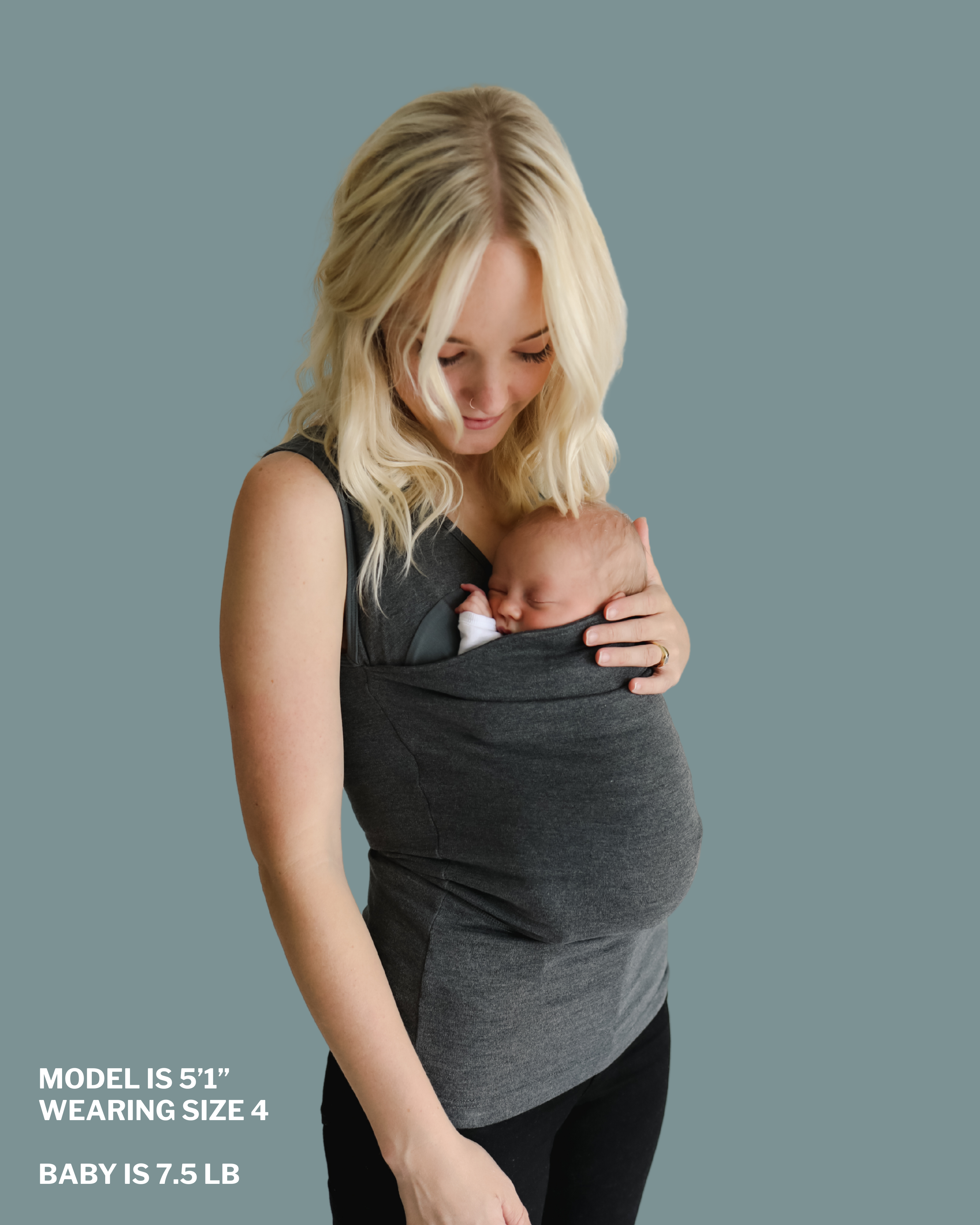 Mom snuggling baby in soothe shirt pouch. "Model is 5 ft 1 in, wearing size 4, baby is 7.5 lbs"