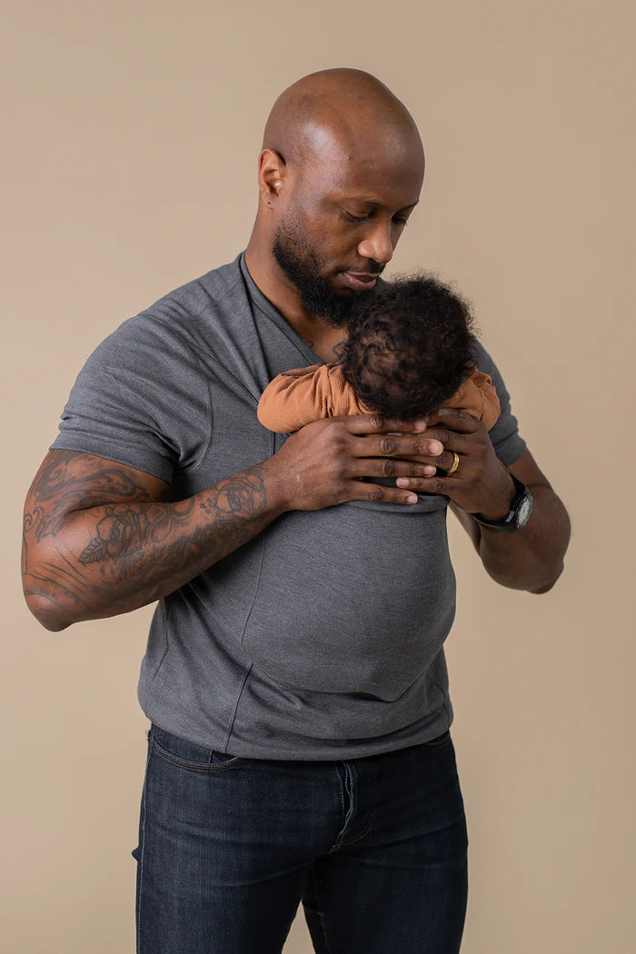 Place hands under baby's armpits to gently pull them out of the pouch.