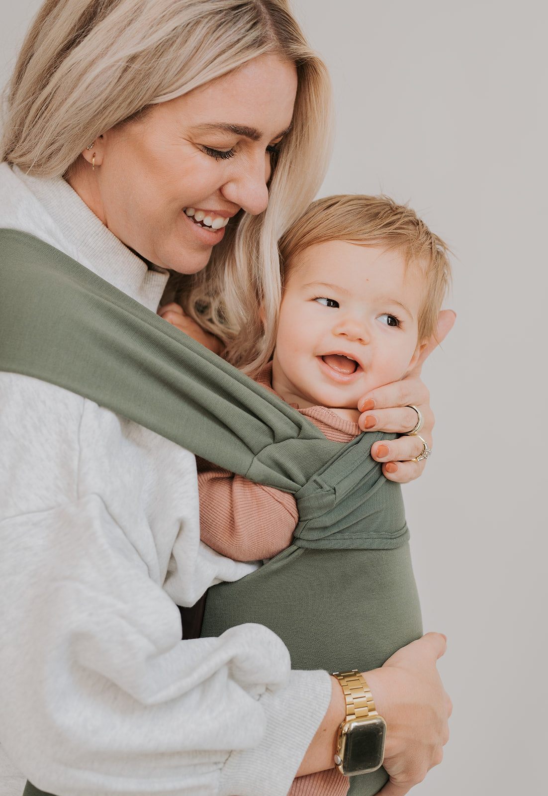 Female front carrying a baby in a Fern Simple Wrap.