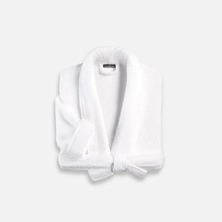 Folded white bath robe