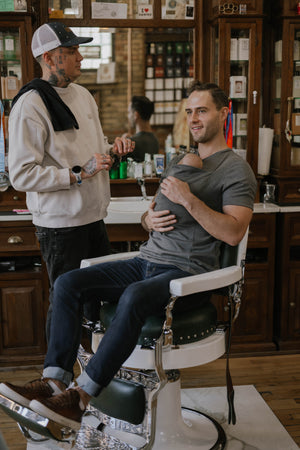 Male sitting in a barber