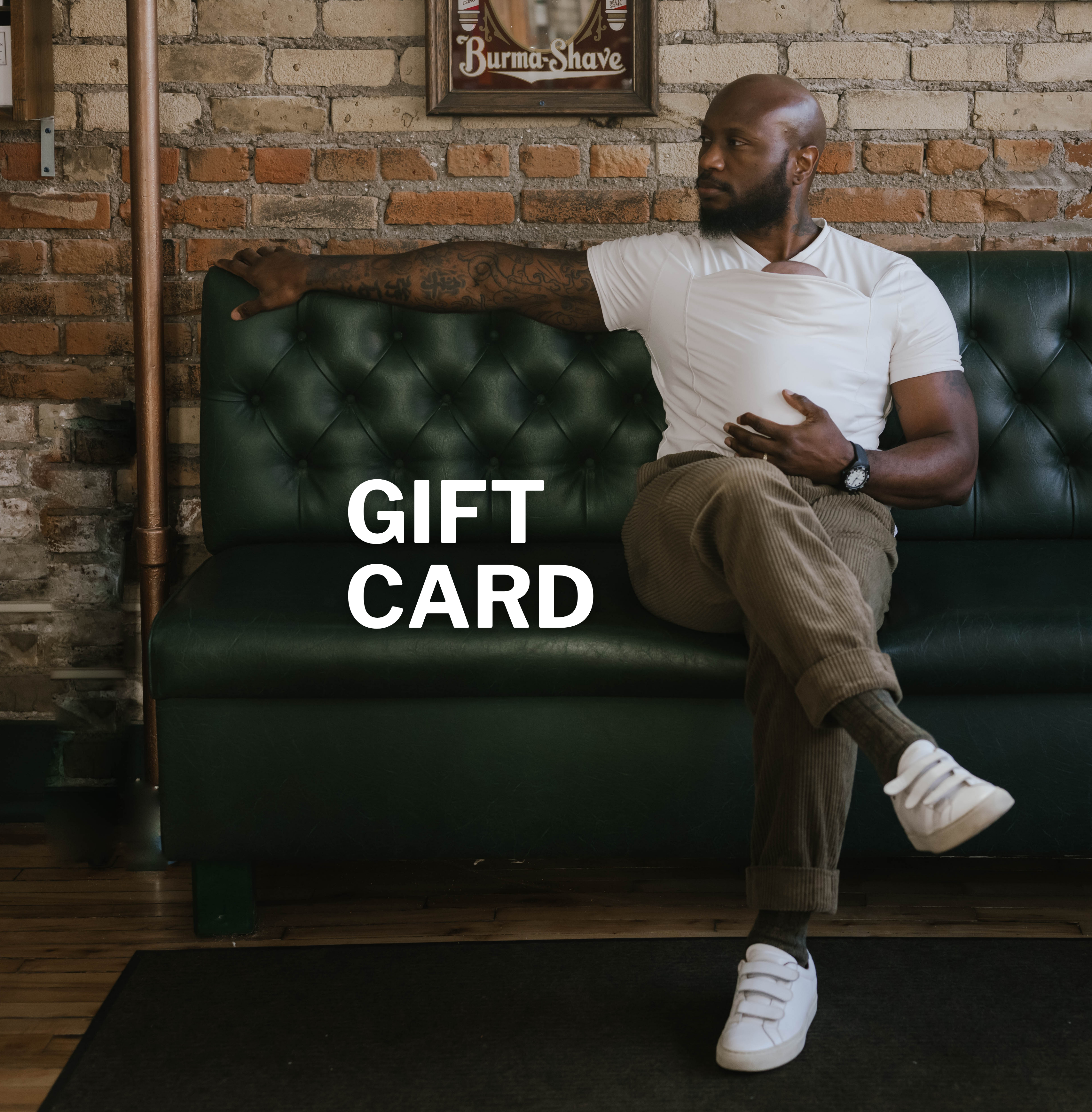 Dad wearing a baby in a natural Dad Shirt. Text reads "Gift Card"