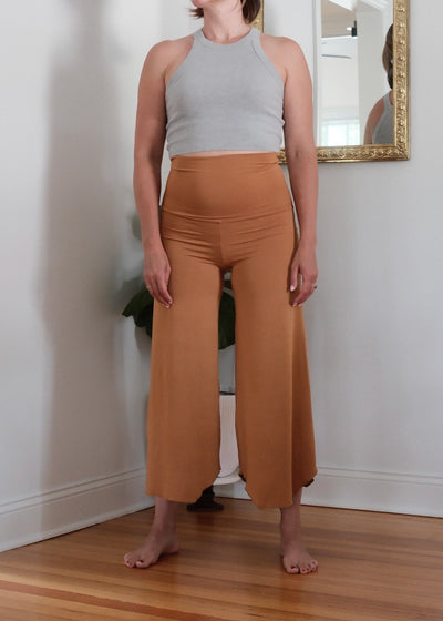 Front view of a female in Camel Flow Pants.