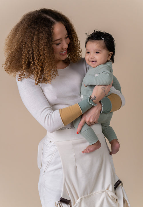Bring baby to chest