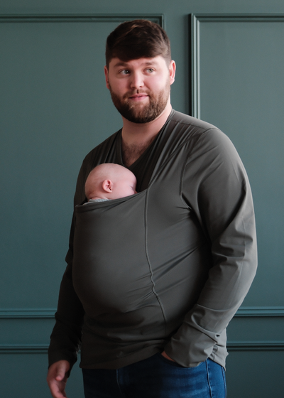 Dad wearing his newborn in the pouch of his Long Sleeve Fern Dad Shirt.