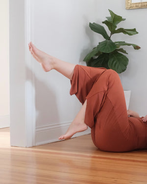 Model working out in Clay Flow Pants