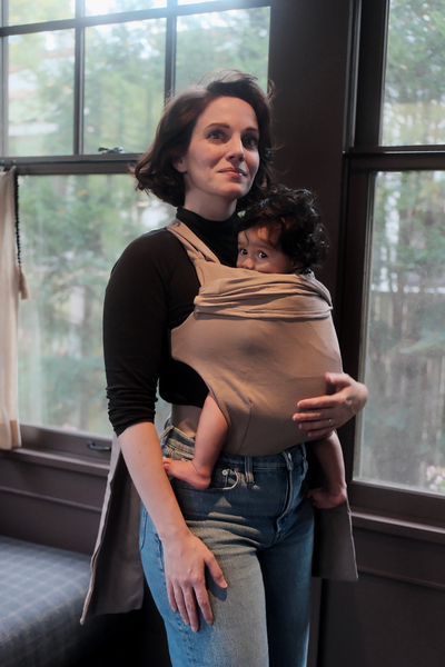 Mom front carrying her baby in a simple wrap. 