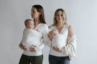 Two females wearing newborns in long sleeve and tank top Natural Soothe Shirts.