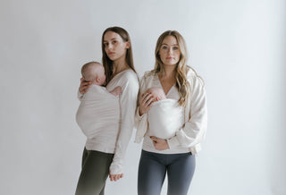 Two females wearing newborns in long sleeve and tank top Natural Soothe Shirts.