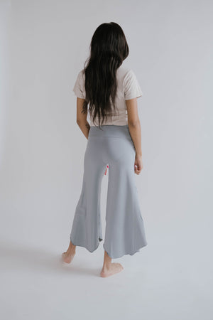 Back view of a pregnant mama wearing Ash Flow Pants