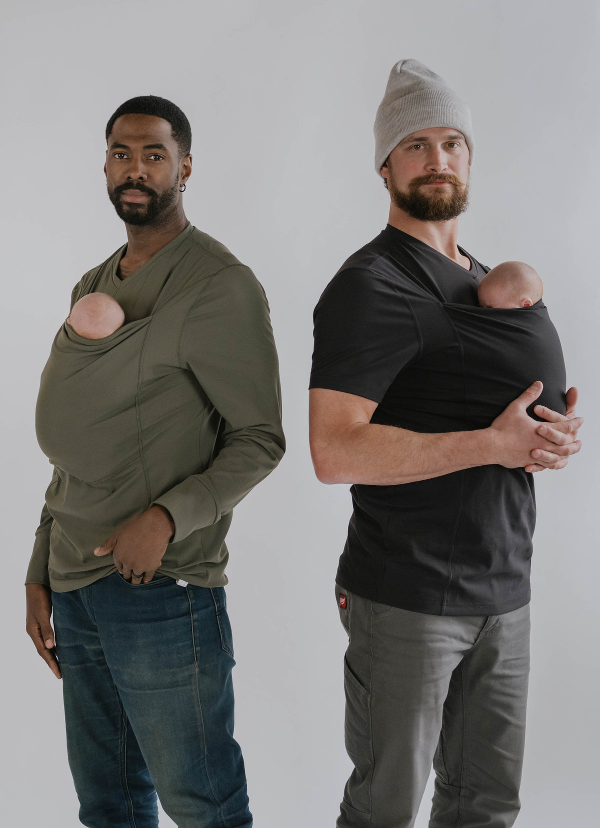 Two males wearing newborns in Dad Shirts.