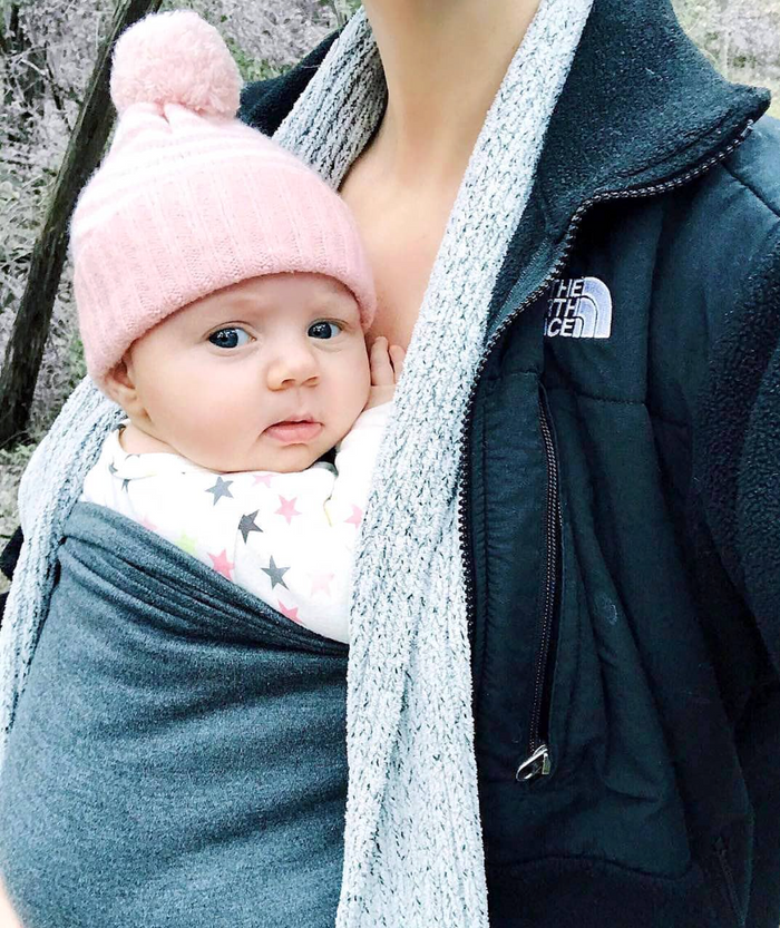 Baby in a Mom Shirt under a winter coat