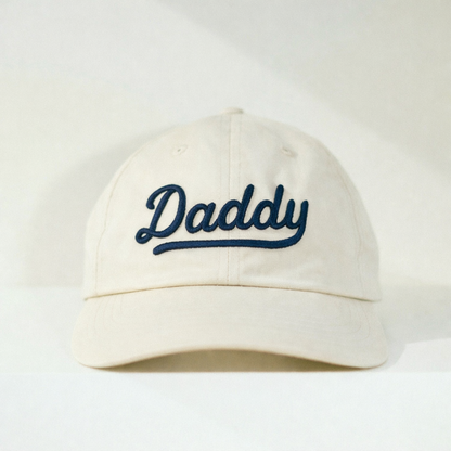 Off white ball cap with navy 3d "Daddy" embroidery