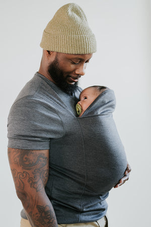 Dad wearing his newborn in a gray Dad Shirt.