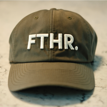 Army green ball cap with off white 3d embroidery of "FTHR."