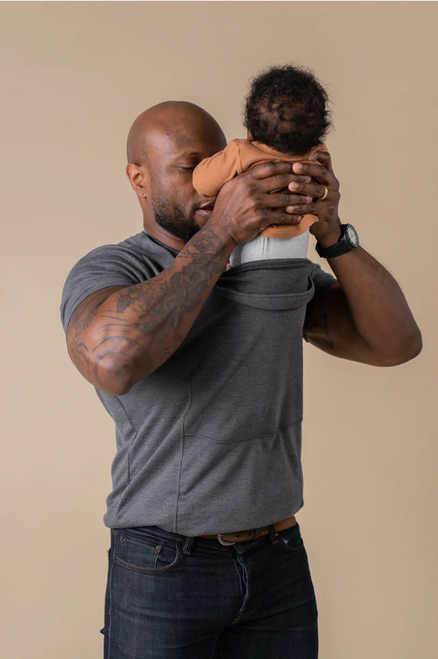 dad taking baby out of grey dad shirt