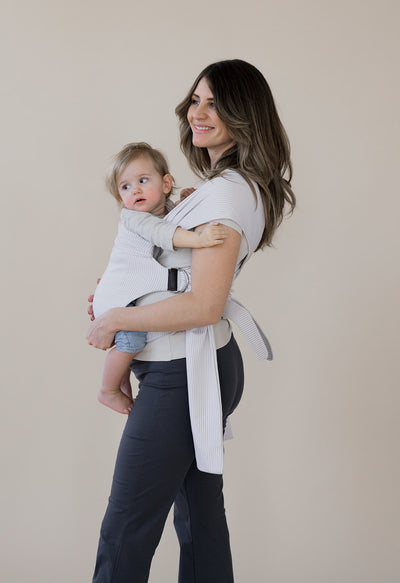 Pregnant mom front carrying her baby in an Oatmeal Stripe Simple Wrap.