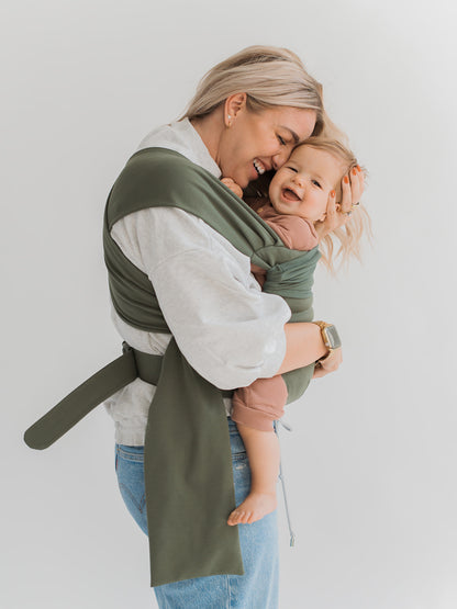 Female front carrying a baby in a Fern Simple Wrap.